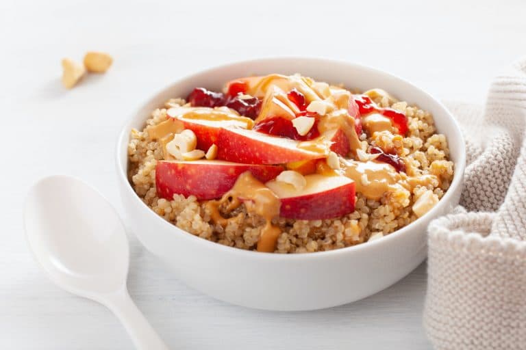 apple peanut butter quinoa bowl with jam and cashew for healthy
